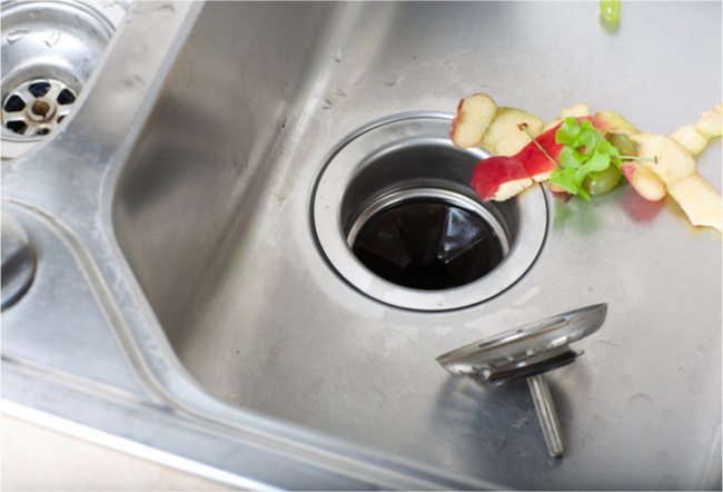 Food going down a garbage disposal